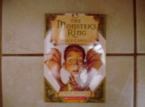 Cover art for The Monster's Ring (A Magic Shop Book)