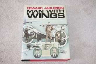 Cover art for Man with wings: A pictorial history of aviation